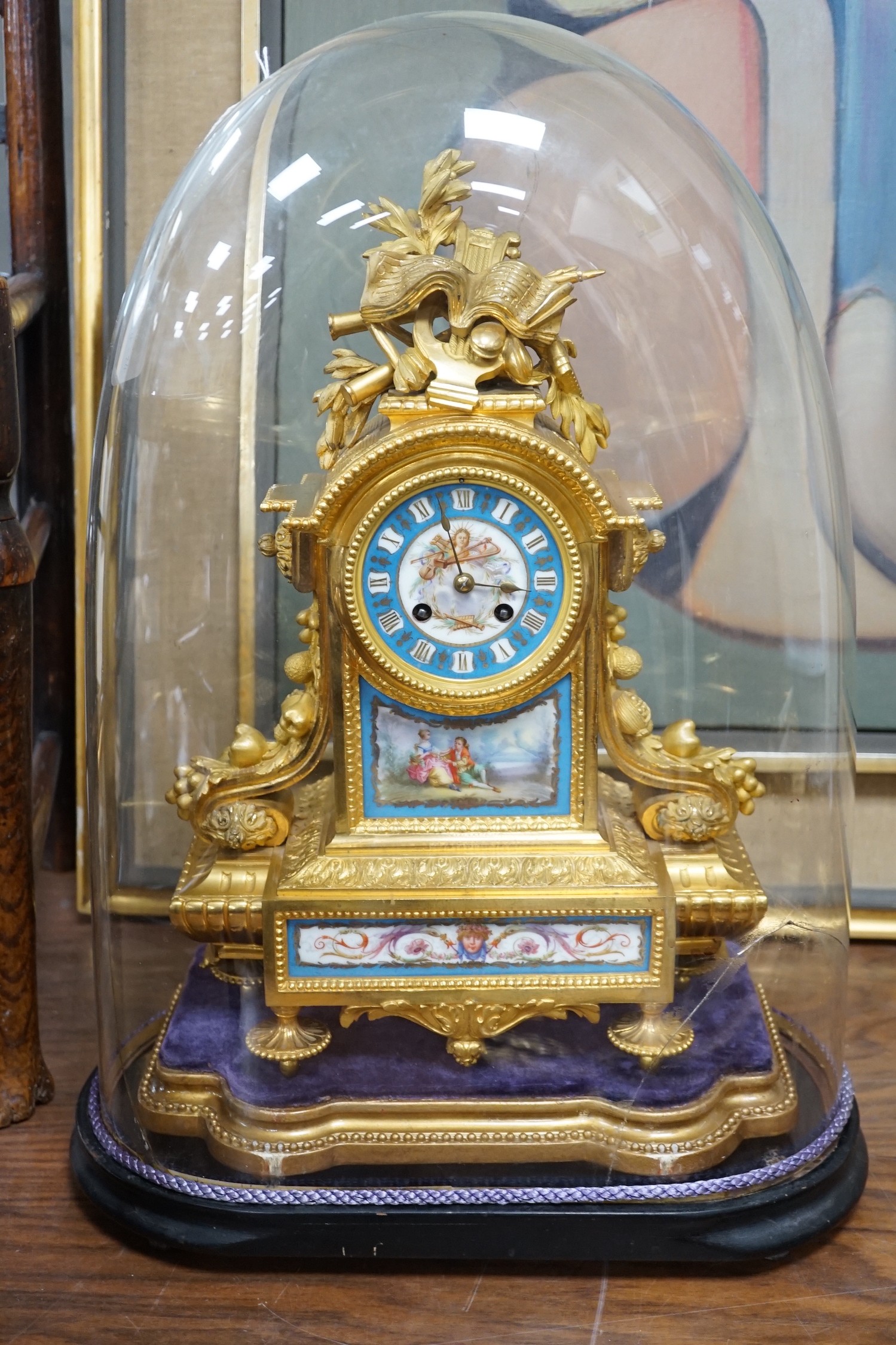 A late 19th century French ormolu and Serves style porcelain mounted mantel clock